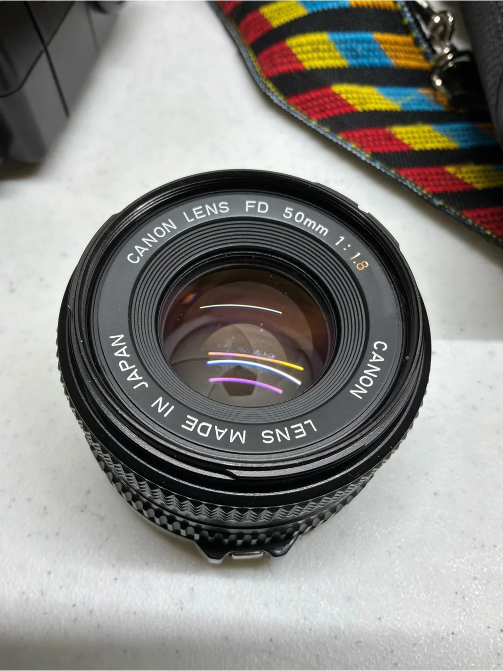 Canon T70 35mm SLR Camera with Black Telephoto Lens and Accessories
